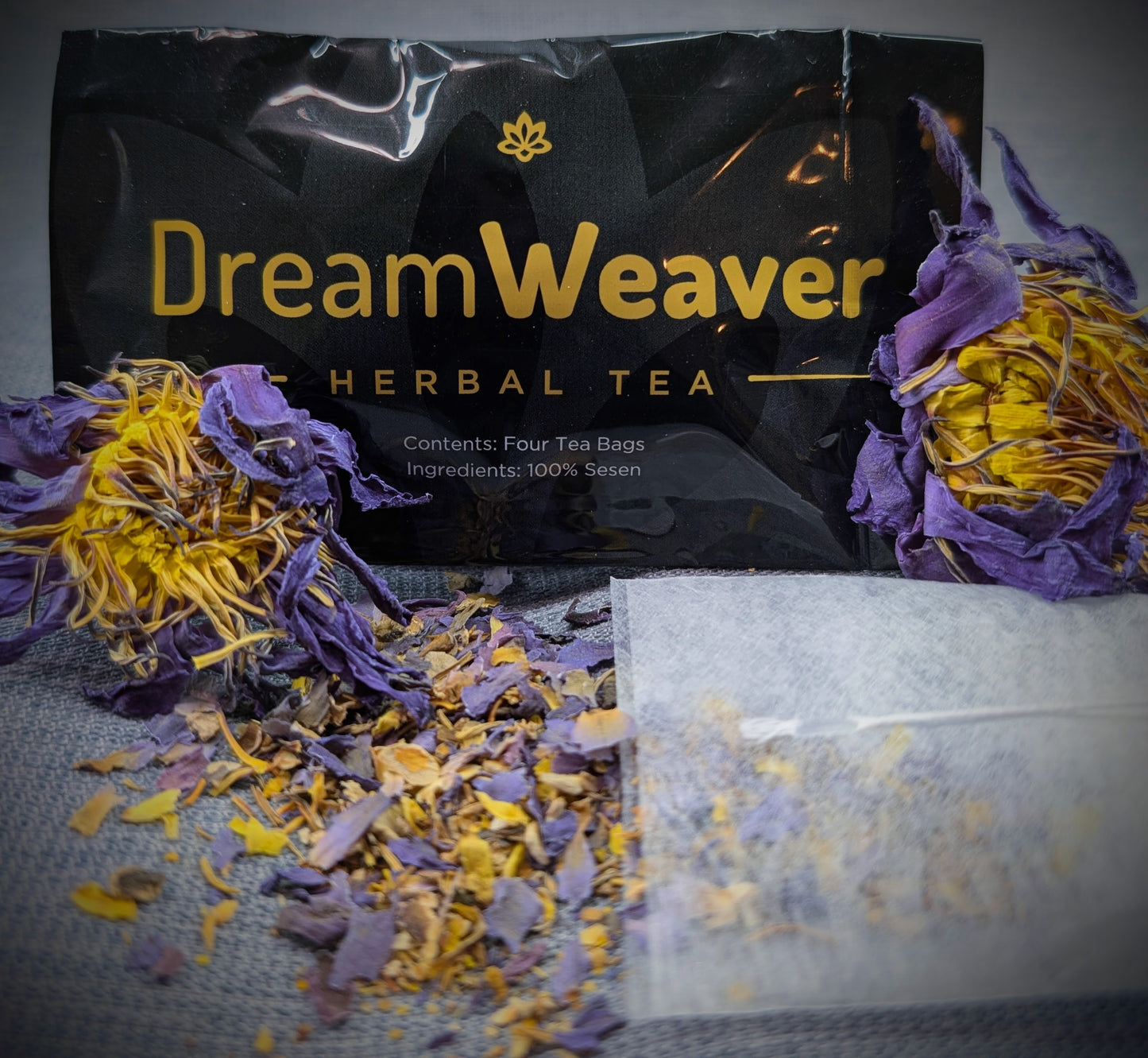 Dream Weaver Herbal Tea packaging with tea bags and dried herbs on a dark background