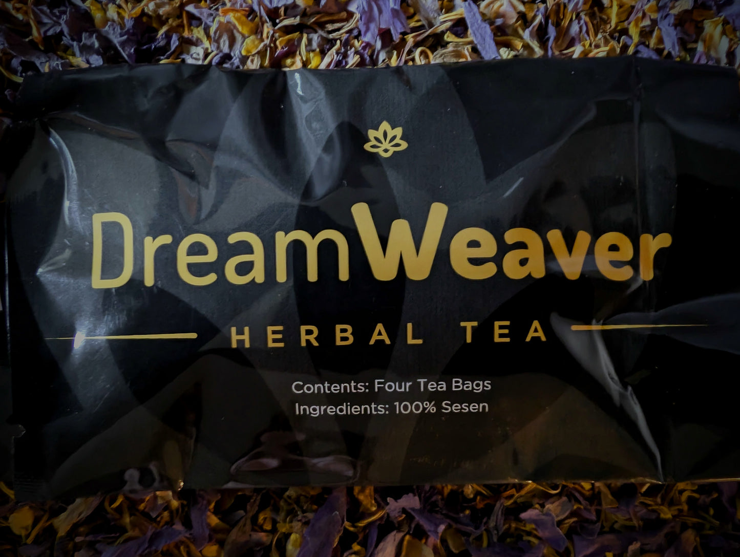 Dream Weaver Herbal Tea packaging visible on top of lotus flowers