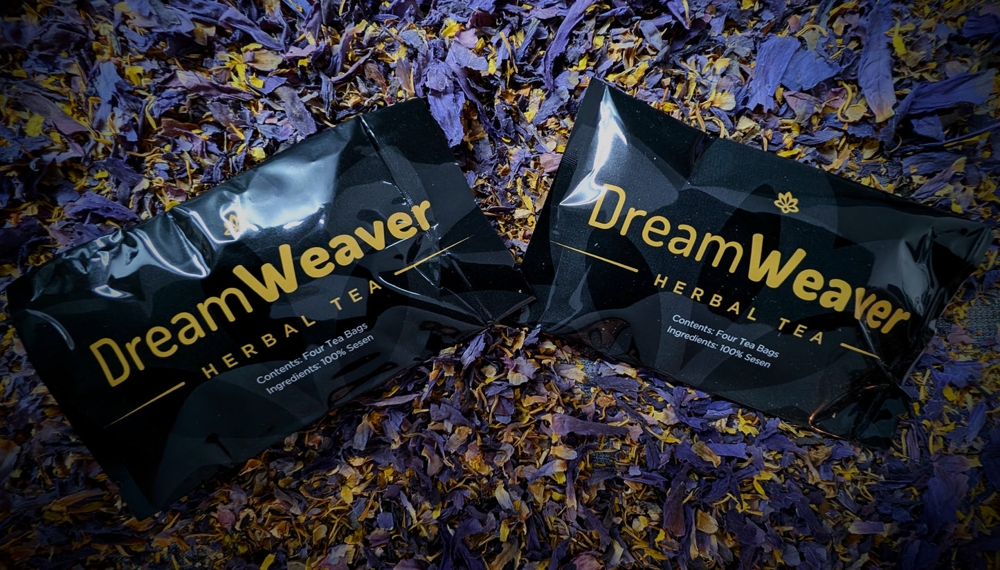 Two Dream Weaver herbal tea packages on a bed of dried flowers.
